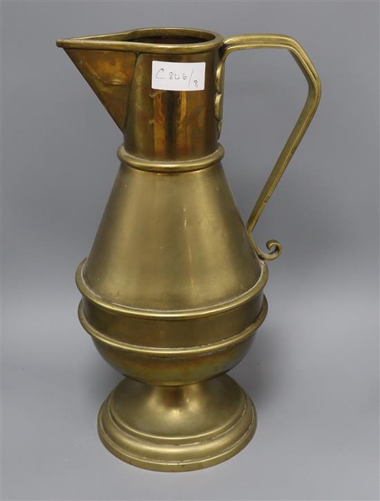 A large brass jug, after Christopher Dresser height 44cm